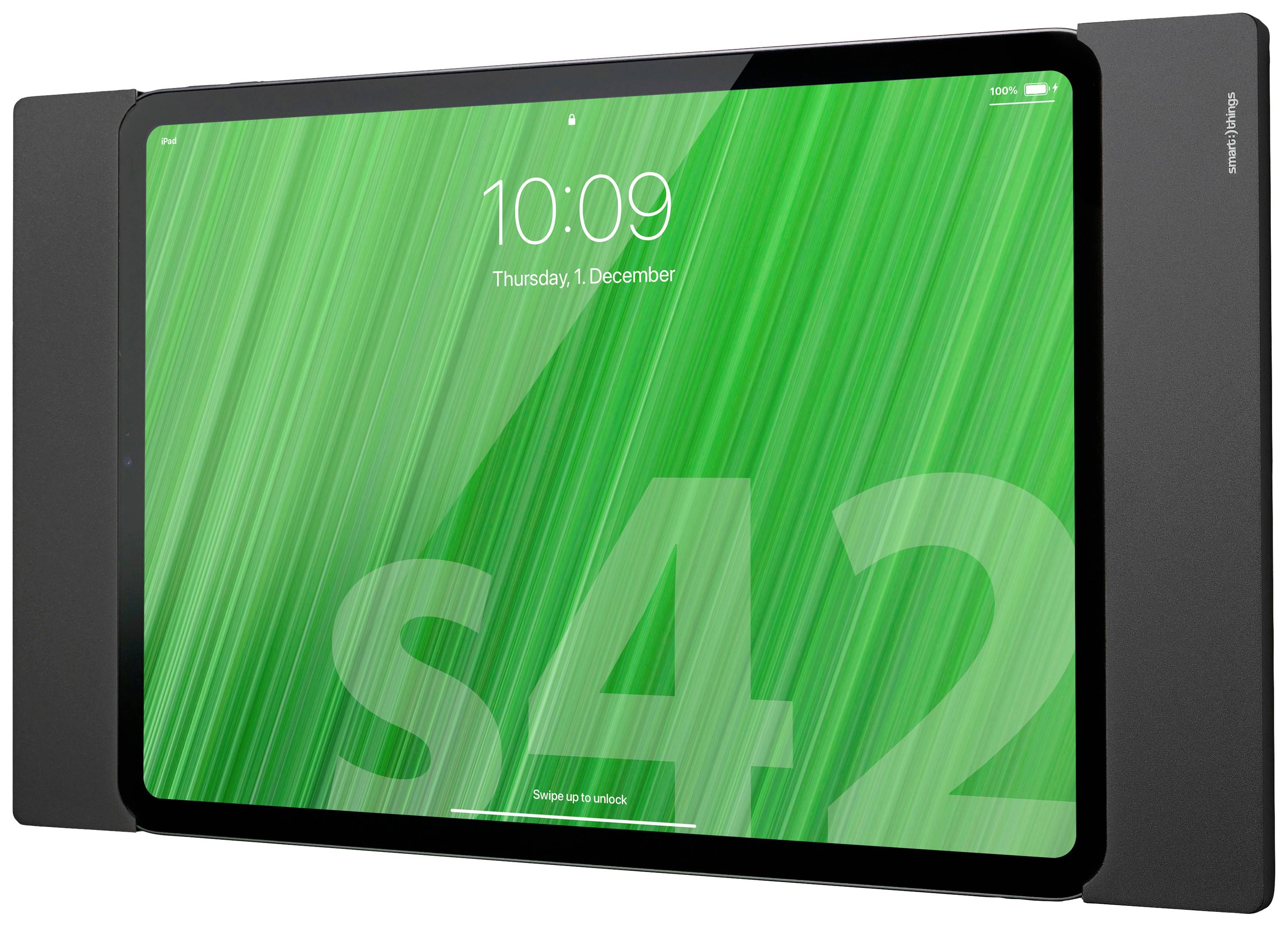 Tablet s černým rámečkem a zeleným pozadím displeje zobrazuje čas 10:09 a datum 'Čtvrtek, 1. prosince'.