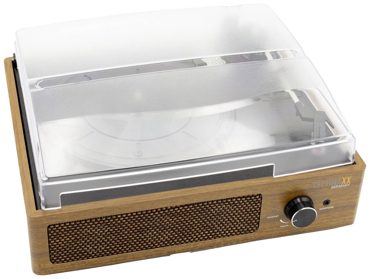 Retro gramofon s dřevěným rámem a plastovým krytem. Má reproduktorovou mřížku a velký otočný ovladač na přední straně.