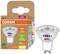 LED žárovka OSRAM a její obal. Žárovka je energeticky úsporná, 2W odpovídá 50W, teplé bílé světlo, patice GU10.