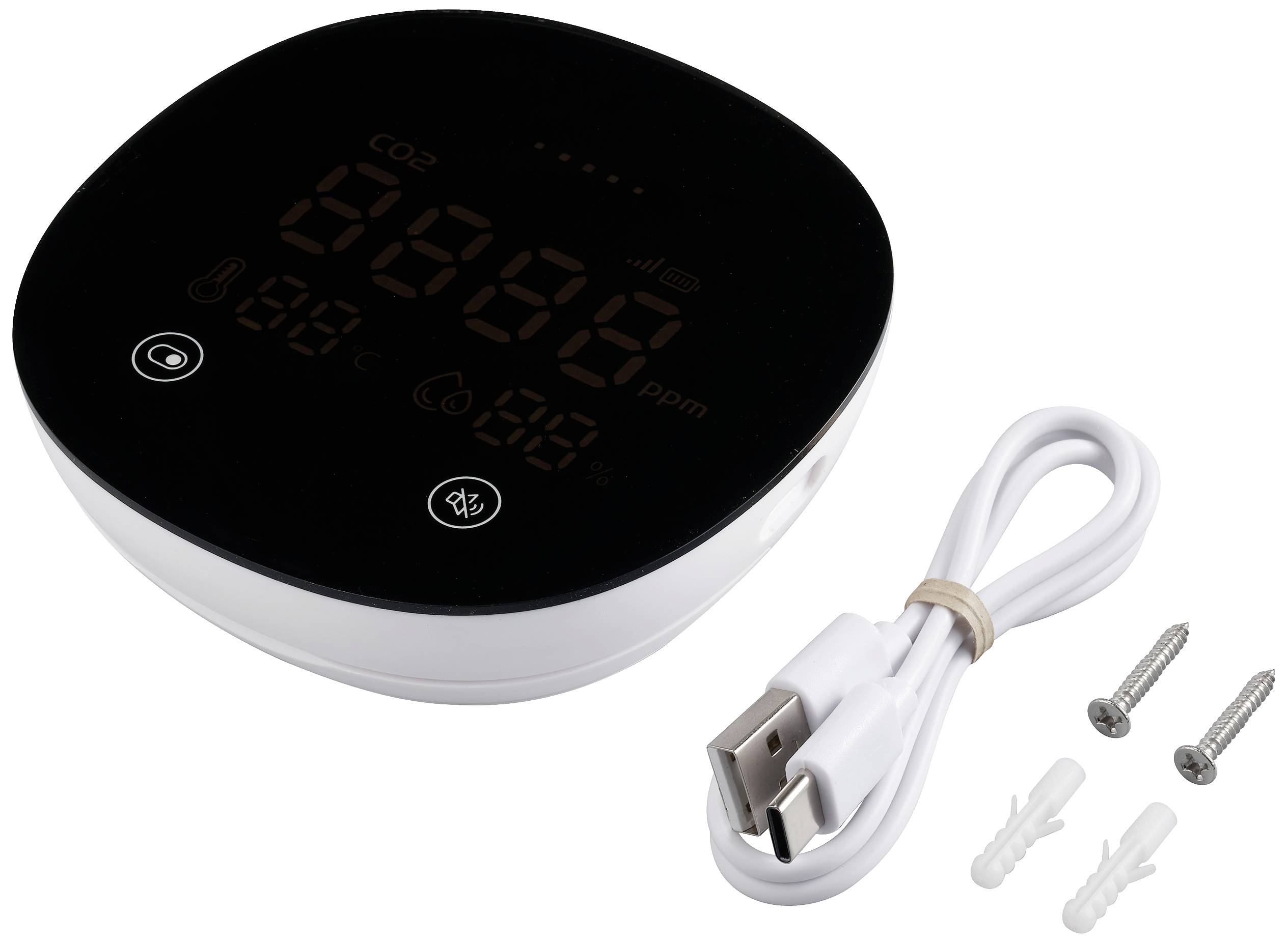 Černý, oválný CO2 měřič s digitálním displejem, vedle něj USB nabíjecí kabel a upevňovací materiály.