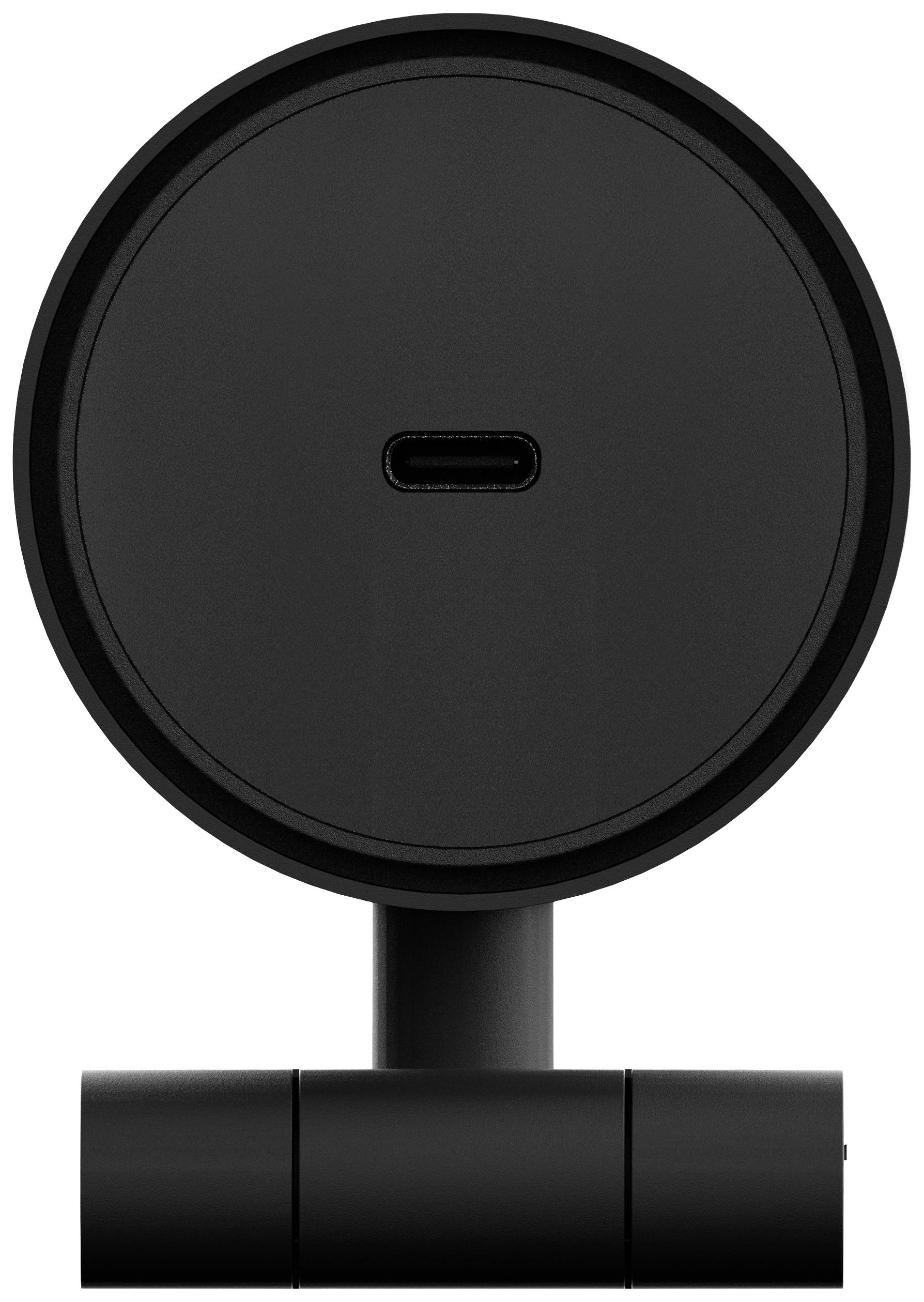 Kulatý černý magnetický stojan s USB-C portem uprostřed, vhodný pro bezdrátové nabíjení zařízení.