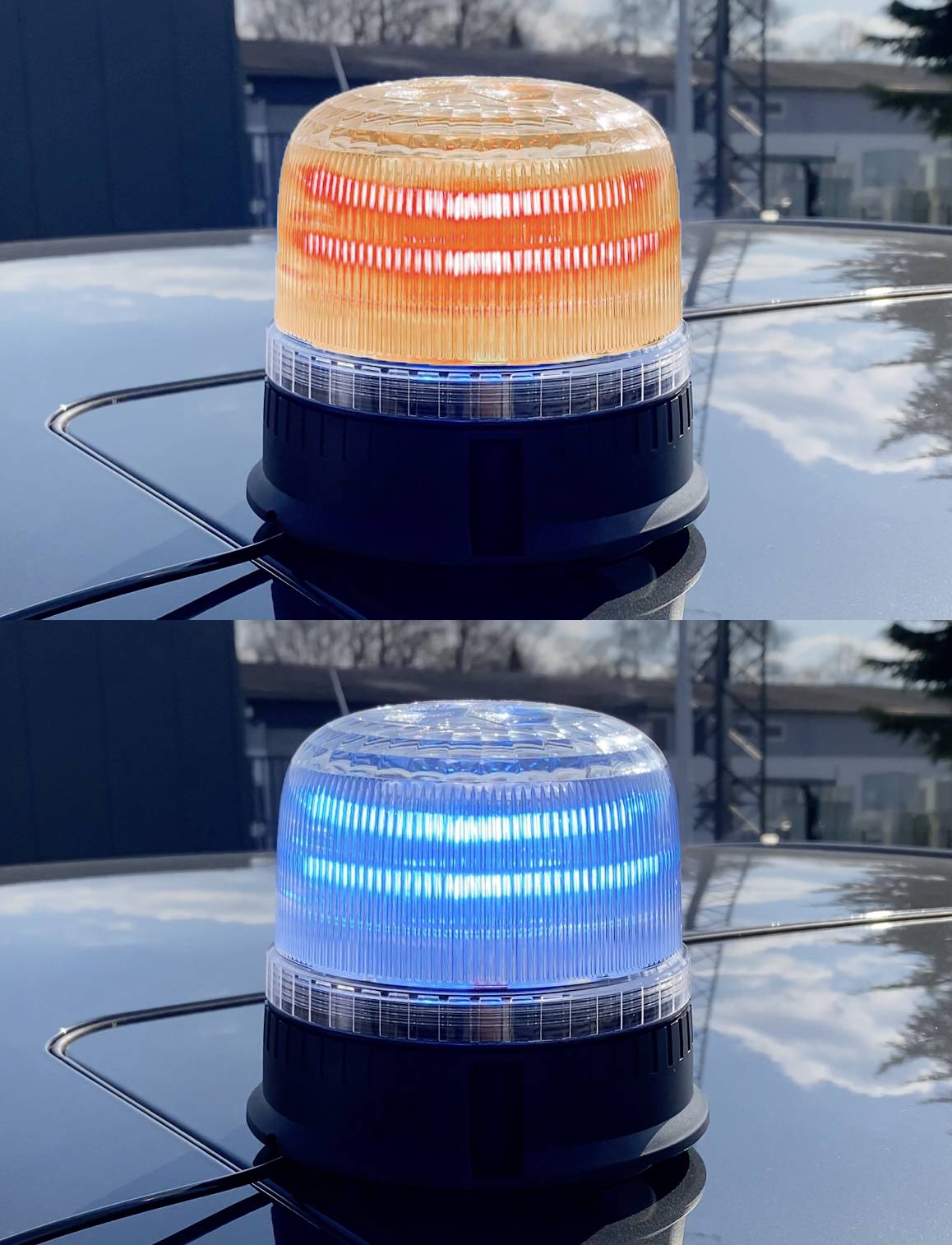 Dvě sirény na střeše automobilu. Horní siréna je oranžová, dolní modrá. Obě sirény se odrážejí na lesklém povrchu.