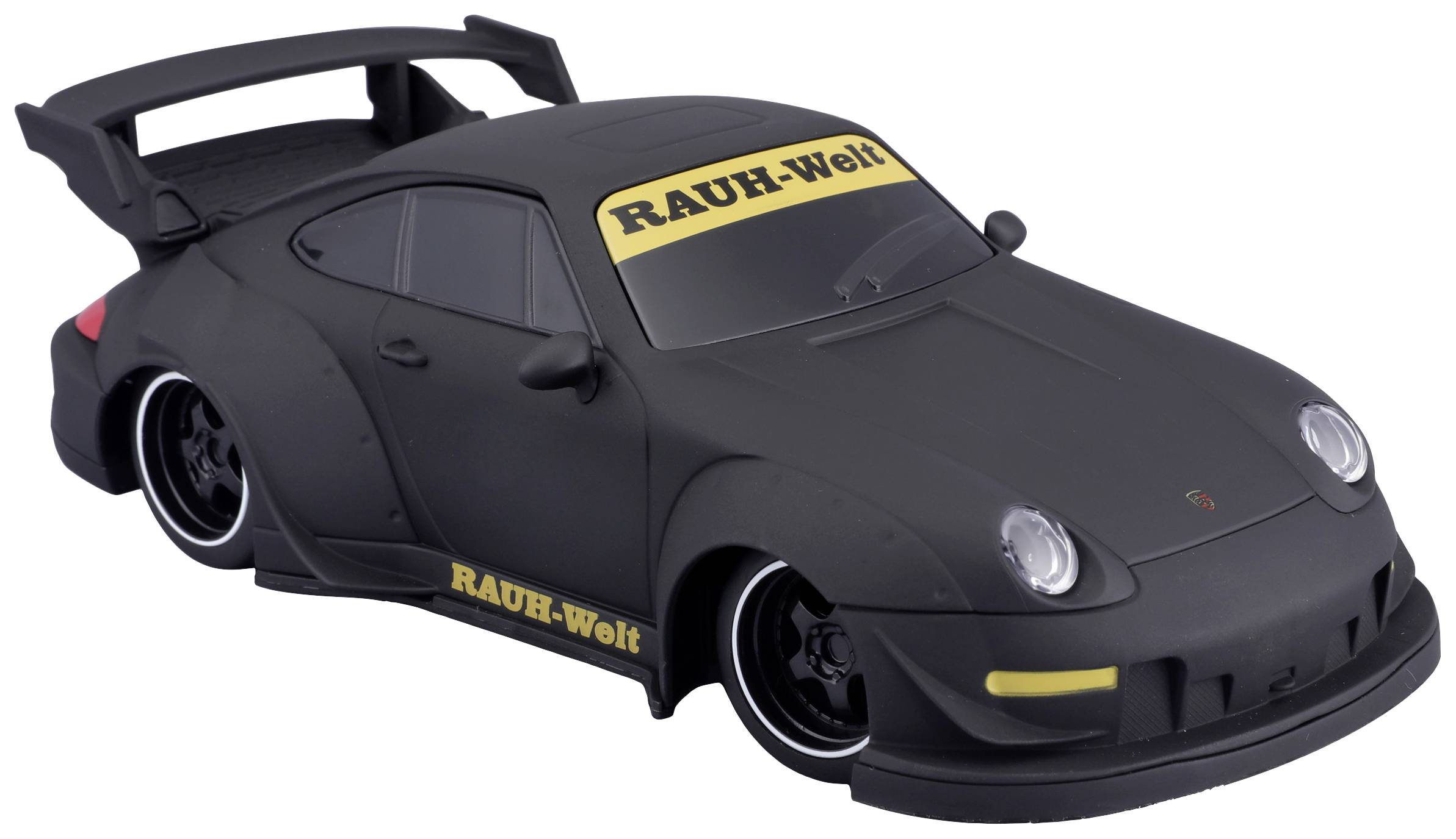 Černé modelové auto se širokým spoilerem. Žluté nápisy 'RAUH-Welt' na čelním skle a prazích. Sportovní design.