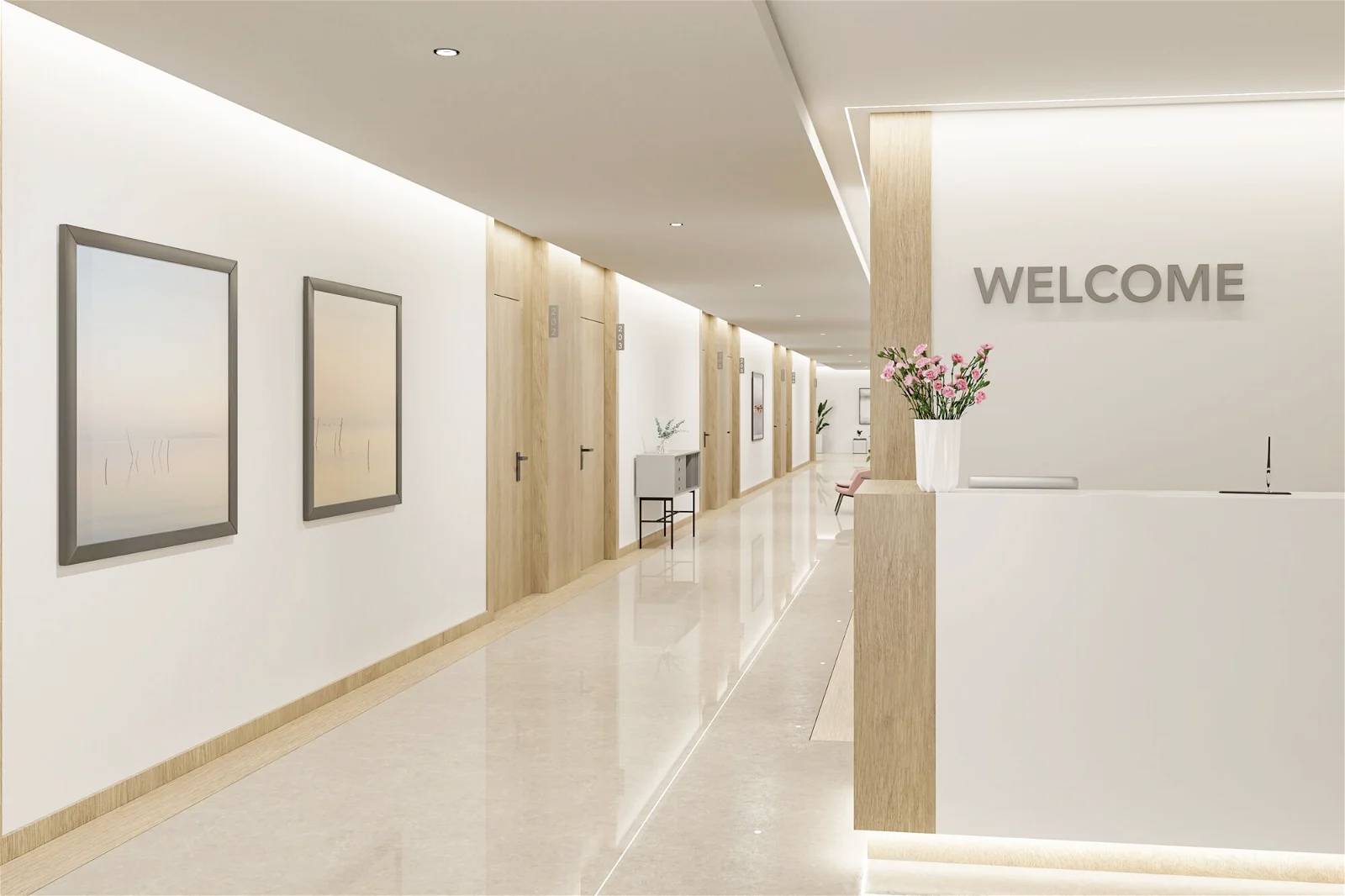 Recepce s cedulí 'WELCOME', moderním nábytkem a obrazy na stěnách. Prostor působí světle a útulně.