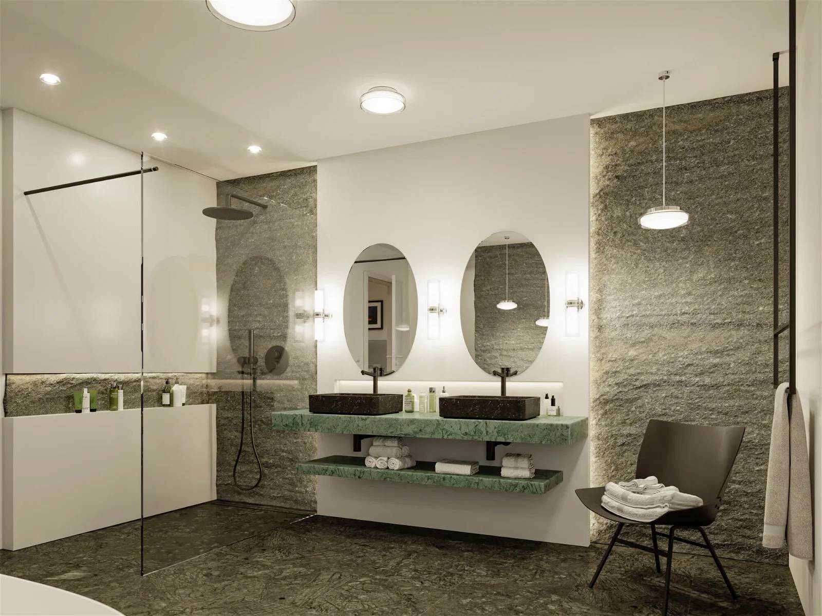 Moderní koupelna se dvěma kulatými zrcadly, dvojitým umyvadlem, sprchovým koutem a držákem na ručníky. Elegantní osvětlení a dekorace.