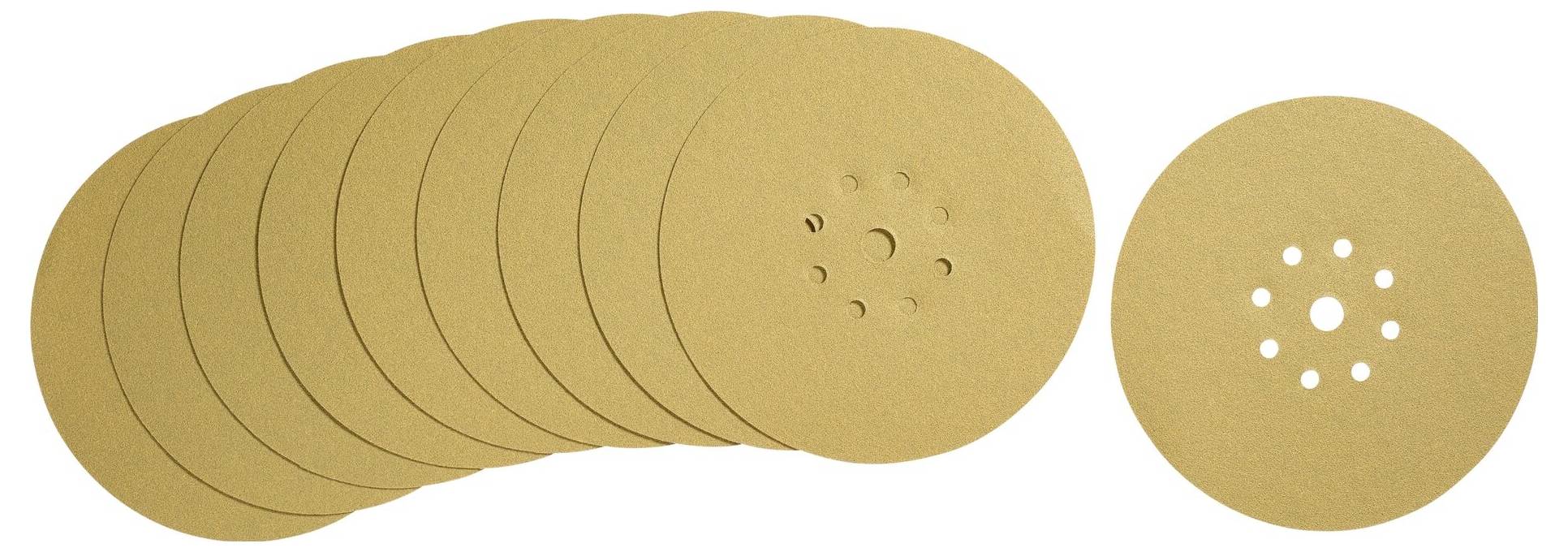 Béžové brusné kotouče s otvory uprostřed, navršené na sebe.