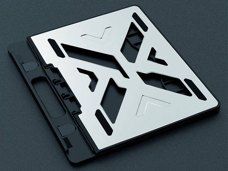 Skládací kovový stojan na notebook s protiskluzovými gumovými podložkami na spodní straně, vhodný pro lepší větrání a stabilitu.