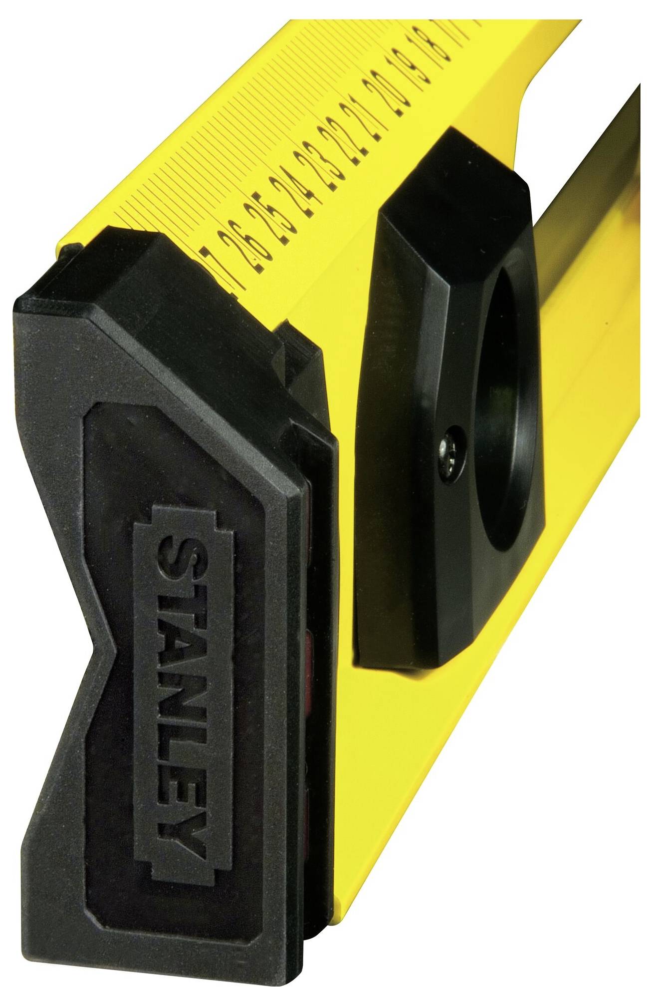 Žlutá vodováha s černými koncovkami a délkovými měřítky. Na nástroji je viditelný název značky.