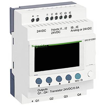 Bílé elektronické řídicí zařízení s digitálními displeji a konektory nahoře, označené štítky 'Vstupy 24VDC' a 'Výstupy 24VDC 0,5A'.