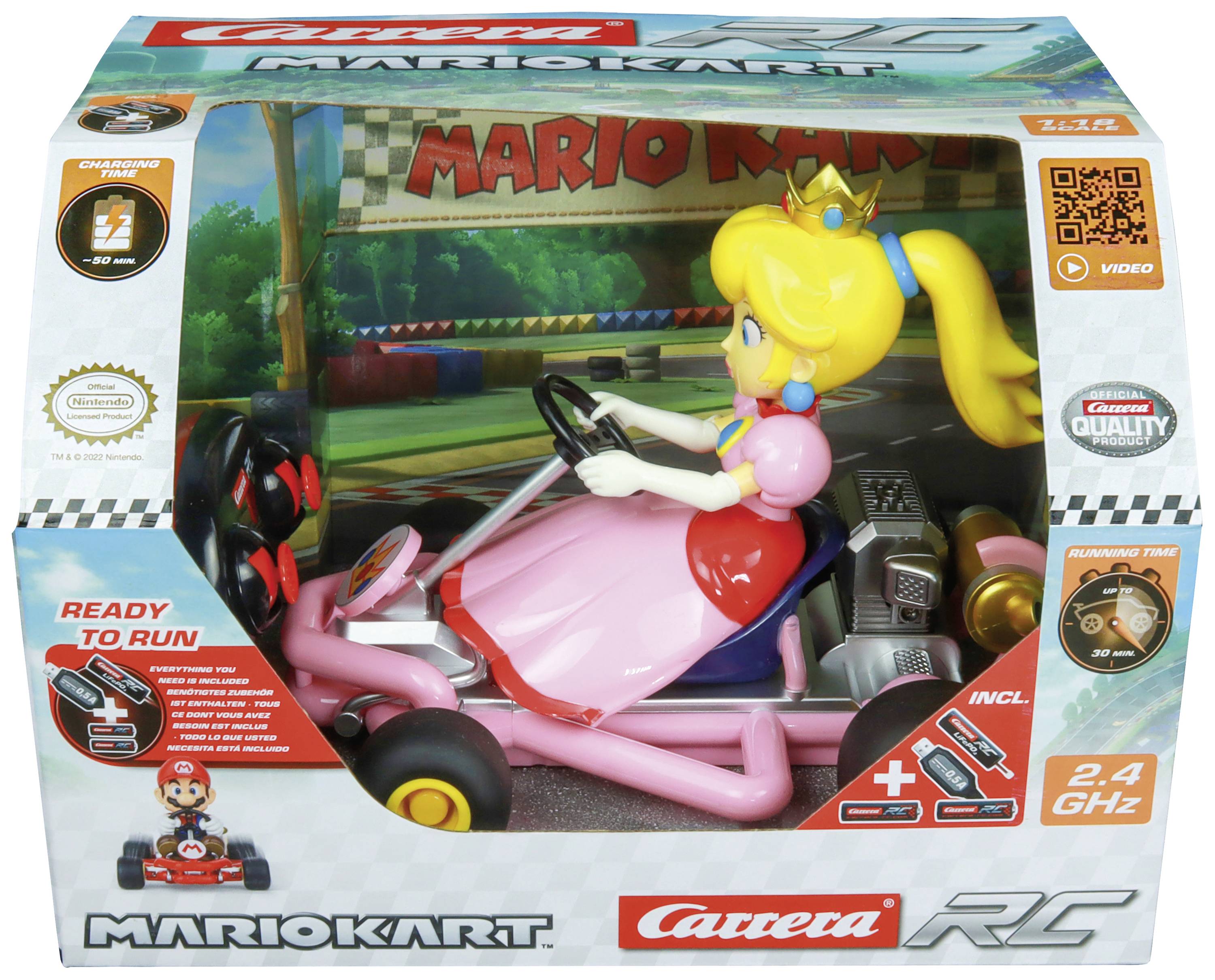 Krabice s hračkou obsahující dálkově ovládaného Mario Karta s figurkou v růžových šatech. Nápis "Mario Kart" a "Ready to Run".