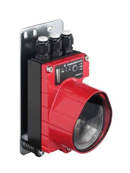 Červené elektronické zařízení se třemi černými konektory nahoře, umístěné na kovovém podstavci. Pravděpodobně se jedná o senzor nebo kameru.