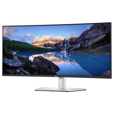 Monitor Dell zobrazující živou krajinu s horami, jasnou oblohou a klidným jezerem odrážejícím scenérii.