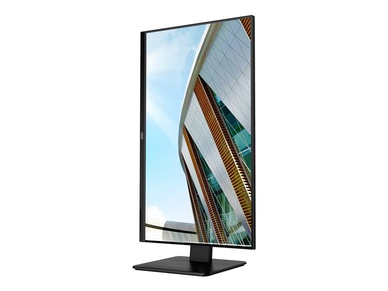 Monitor ve svislé orientaci zobrazuje moderní budovu se skleněnými okny a dřevěnými prvky před modrým nebem.