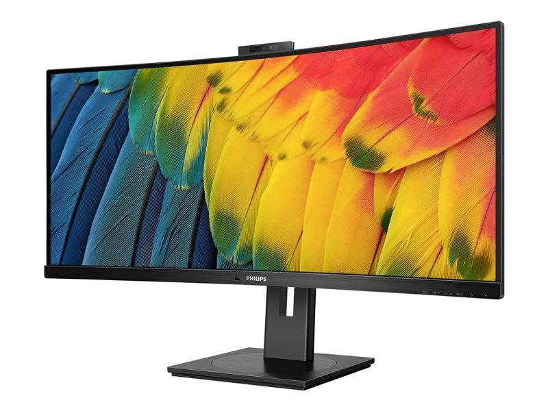 Široký počítačový monitor s osvětleným displejem v barvách paví peří, umístěný na černém stojanu.