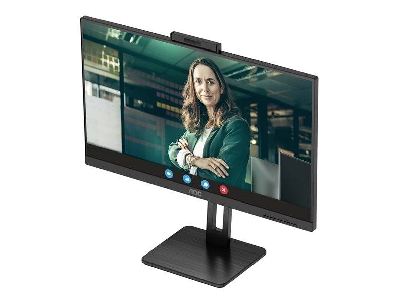 Žena v zelené oblečení se usmívá ve scéně videohovoru na monitoru počítače.
