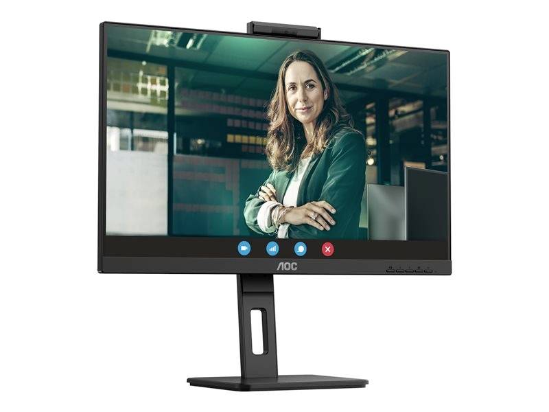 Na monitoru se nachází obrazovka videokonference s osobou, která přátelsky usmívá, obklopená kancelářským prostředím.