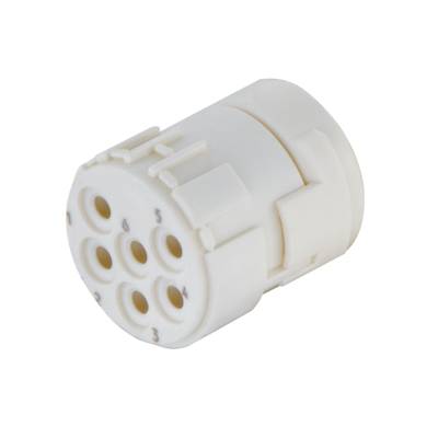 Bílý válcový zástrčkový adaptér se šesti kruhovými konektory.