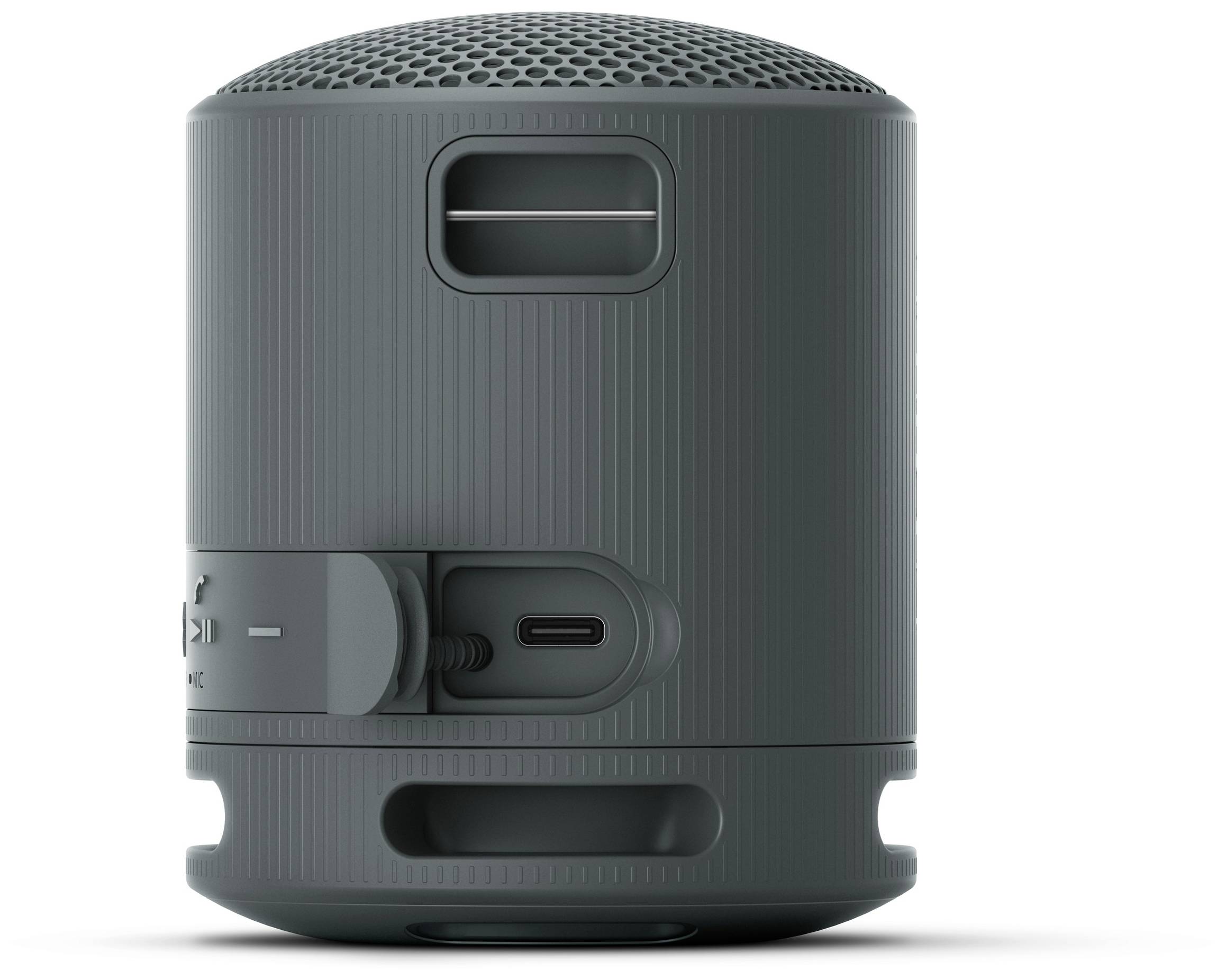 Přenosný šedý bluetooth reproduktor s kulatým tvarem. Na horní straně je viditelná reproduktorová mřížka, po straně jsou ovládací prvky.