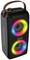 Přenosný reproduktor s barevnými LED světly kolem reproduktorů, tmavě šedým tělem a koženou rukojetí. Nahoře jsou umístěny ovládací prvky.