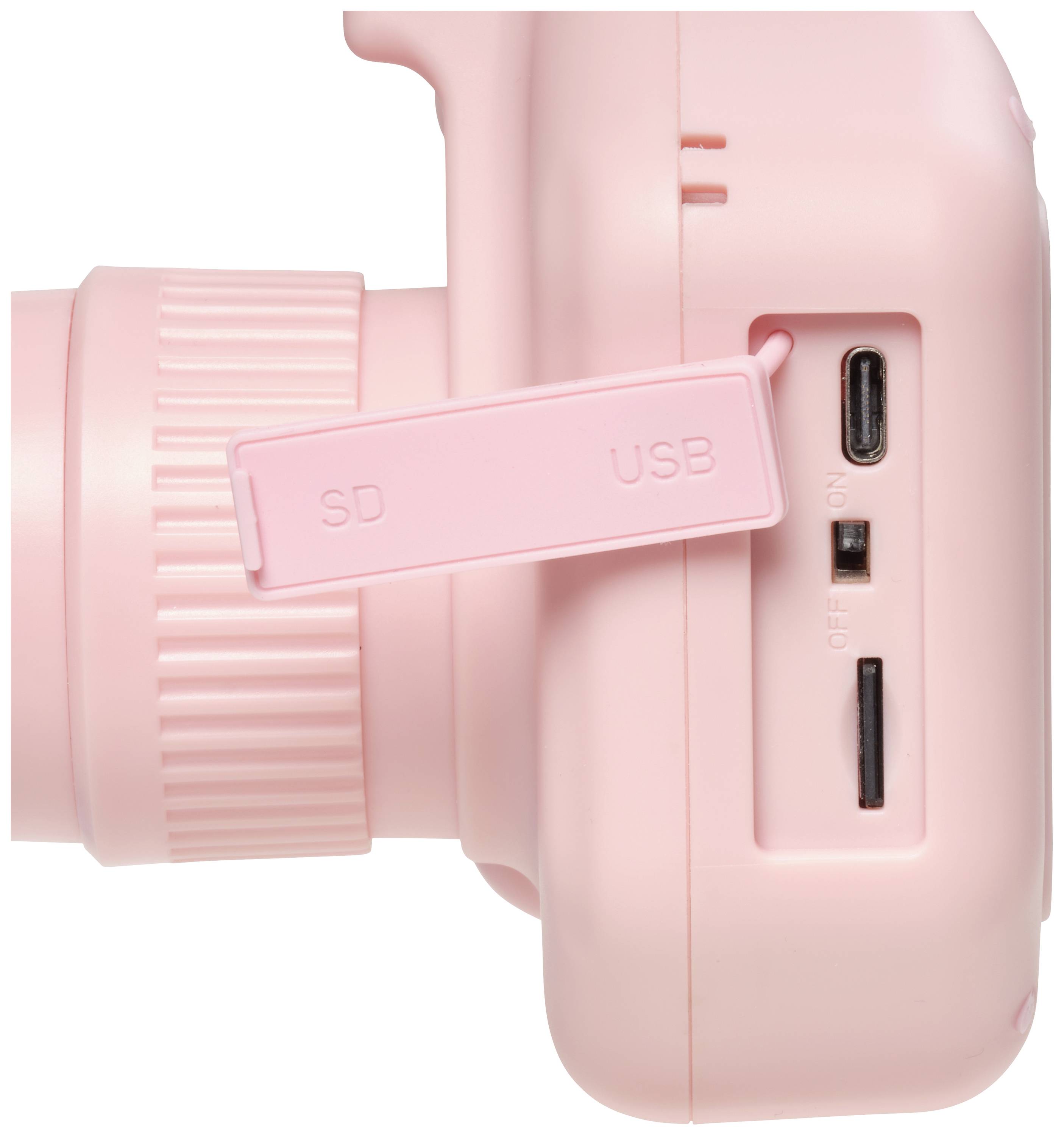 Kompaktní, růžový fotoaparát s bočními sloty pro SD kartu a USB, kolečkem pro nastavení zaostření a přepínačem s polohami 'ZAP' a 'VYP'.