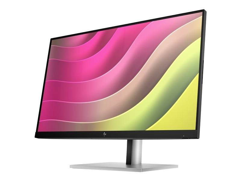 Moderní počítačový monitor s barevným vlnitým pozadím v růžové, zelené a žluté barvě.