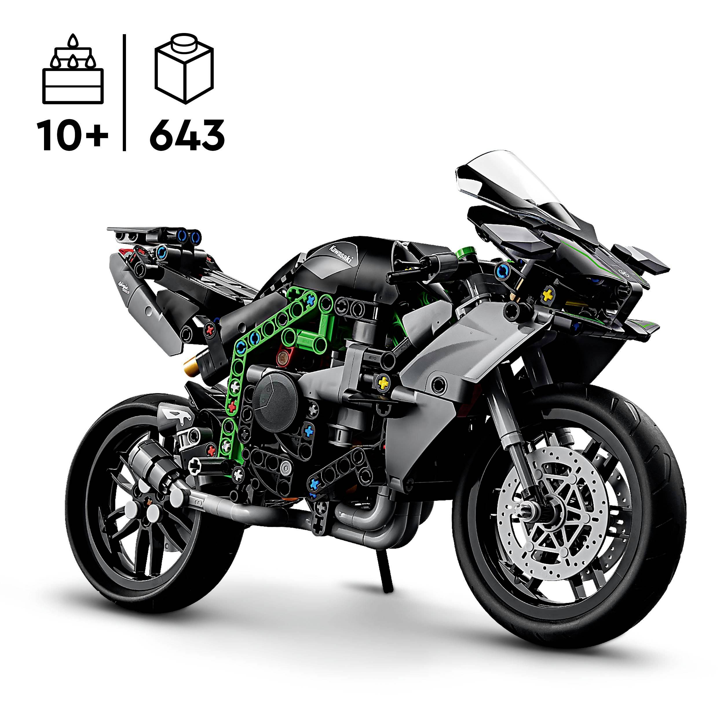 Motocyklový model ze stavebních dílků s černými a zelenými díly, doporučeno pro děti od 10 let, 643 dílků.