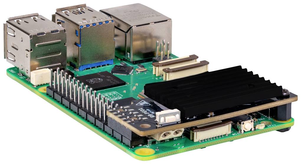 Jednostránkový počítač s několika USB porty a chladičem na zelené desce plošných spojů. Ideální pro DIY technické projekty.