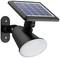 Solární venkovní svítidlo s fotovoltaickým modulem nahoře a kulatým světlem pod ním, namontované na zdi.