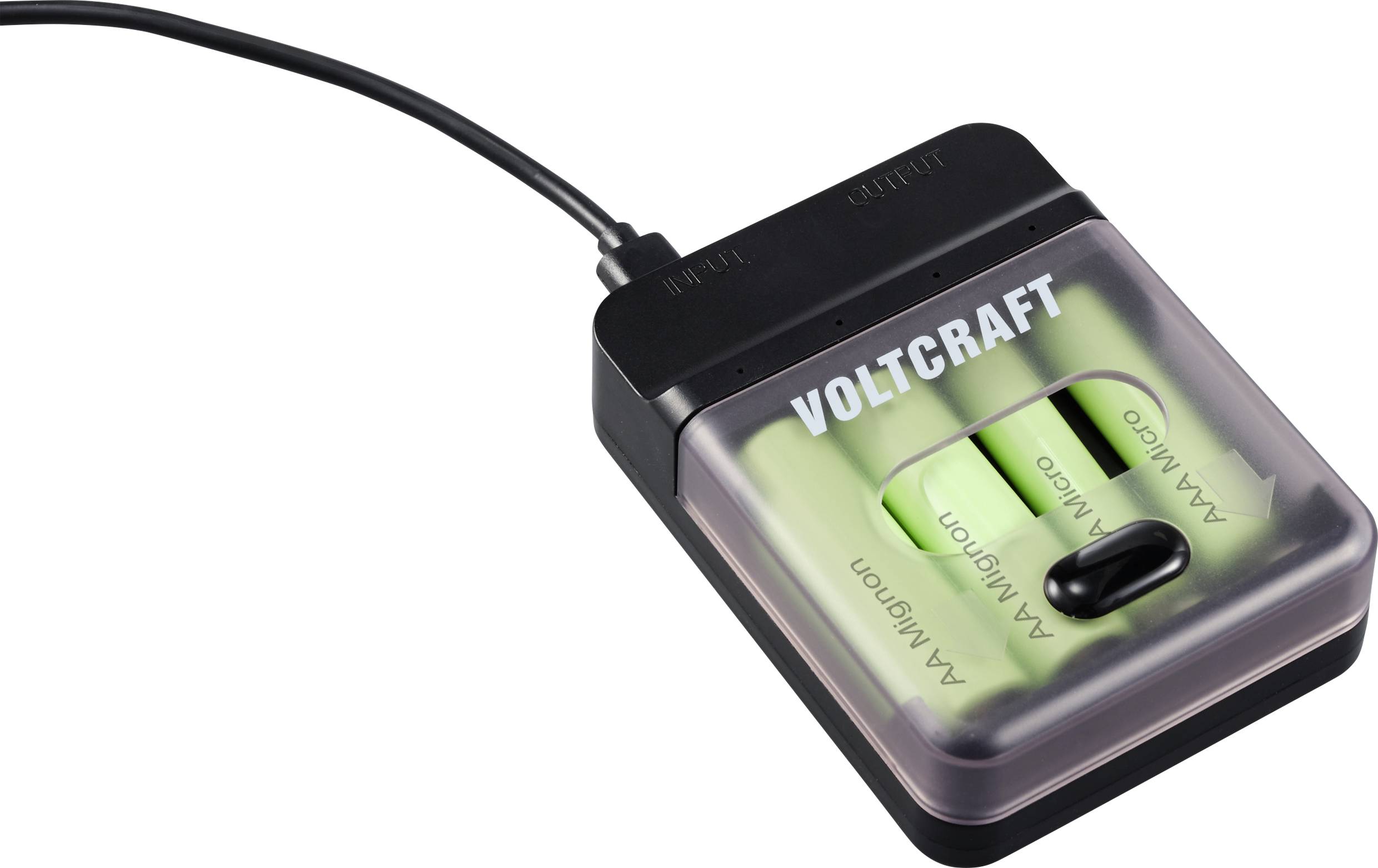Nabíječka baterií se dvěma nabitými bateriemi AA. Značka 'Voltcraft'. Napájecí kabel připojen nahoře, indikátor nabíjení není viditelný.