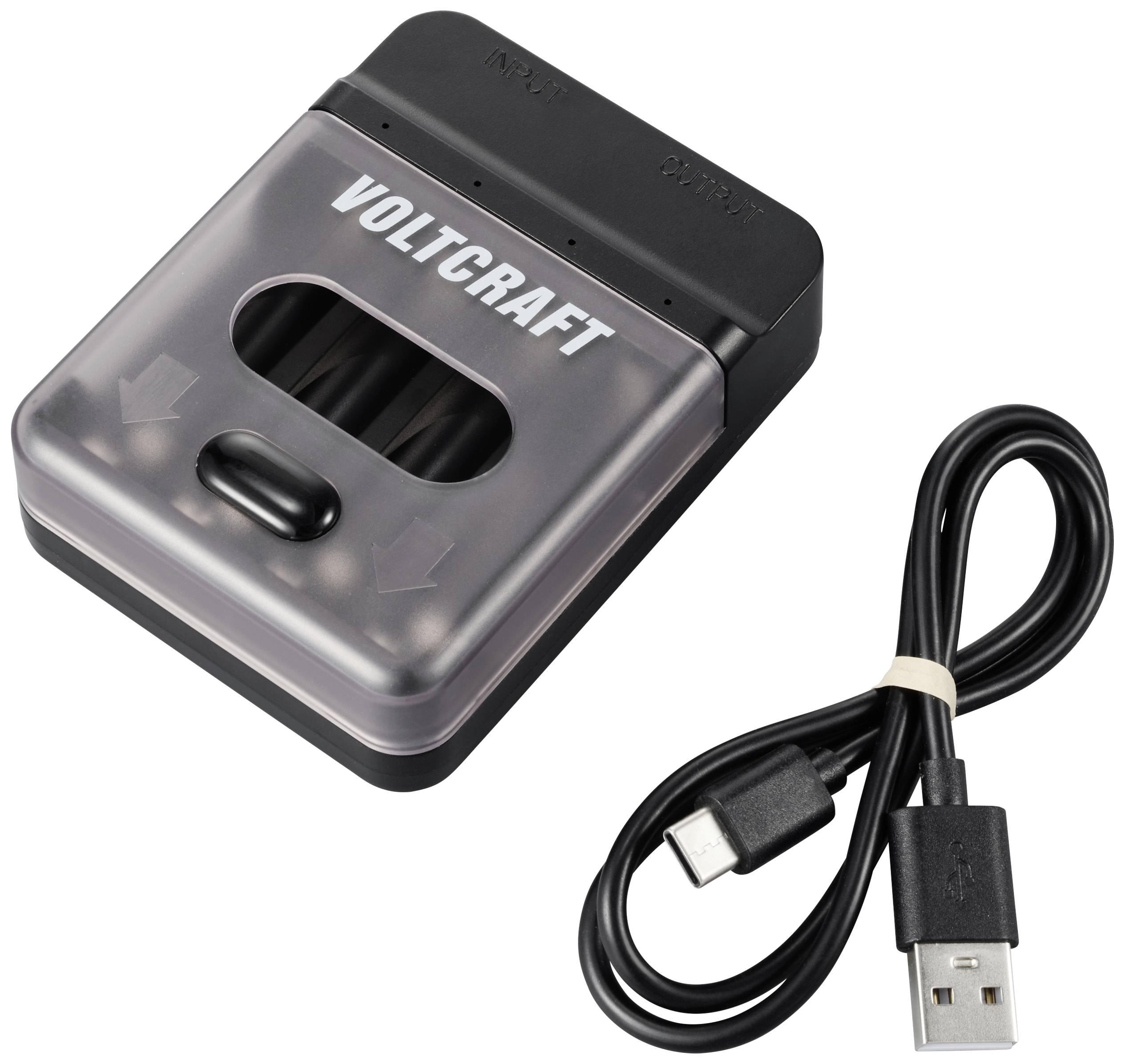 Nabíječka baterií značky Voltcraft s USB kabelem pro připojení.