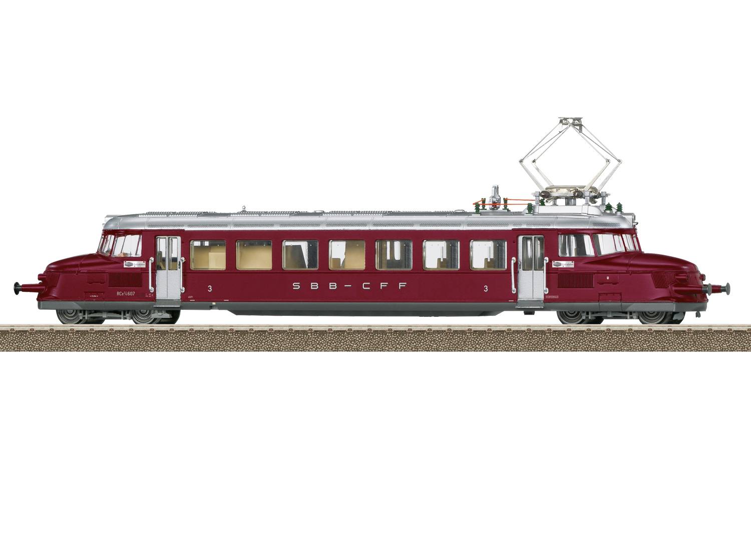 Červený vlak SBB-CFF na kolejích. Má nostalgický design s podvozkem na každé straně a pantografem nahoře.