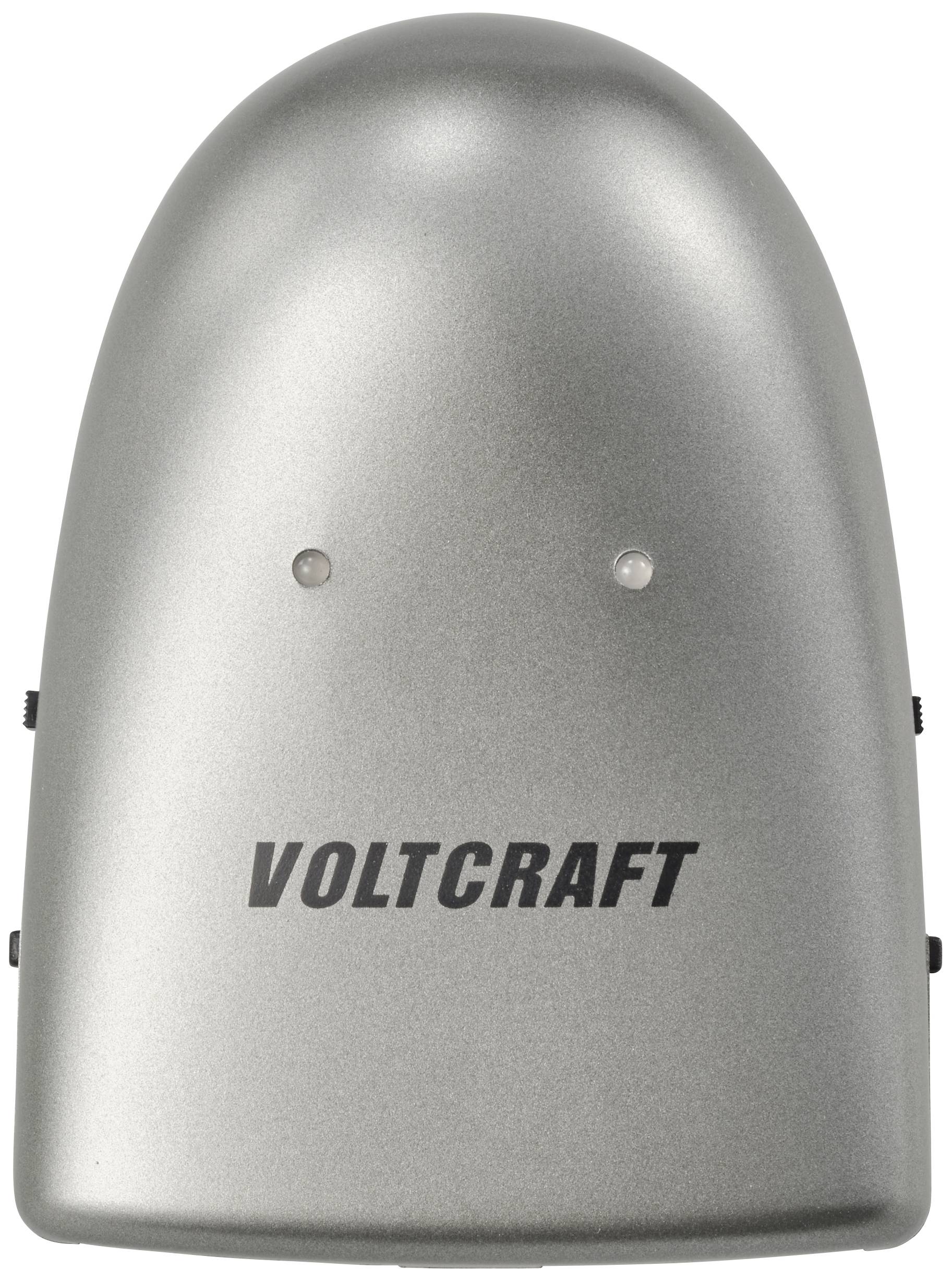 Stříbrné zařízení se dvěma světly a nápisem 'Voltcraft' na přední straně.