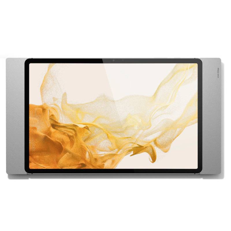 Tablet s velkým displejem zobrazuje abstraktní, vlnovitý vzor v odstínech oranžové a žluté na bílém pozadí.