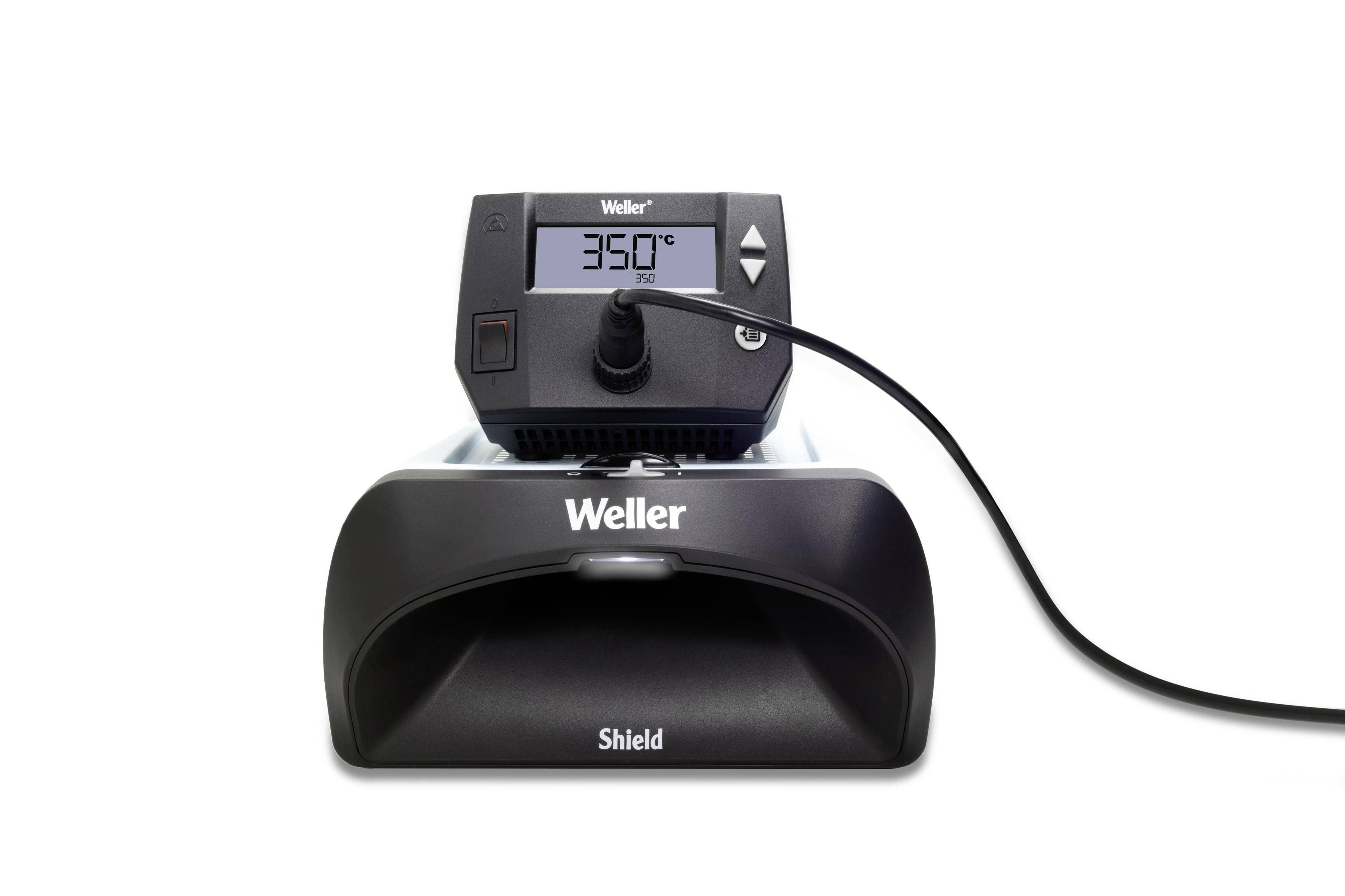 Pájecí stanice s digitálním displejem, ukazující 350 stupňů Celsia. Černá rukojeť a napájecí kabel, značka 'Weller Shield'.