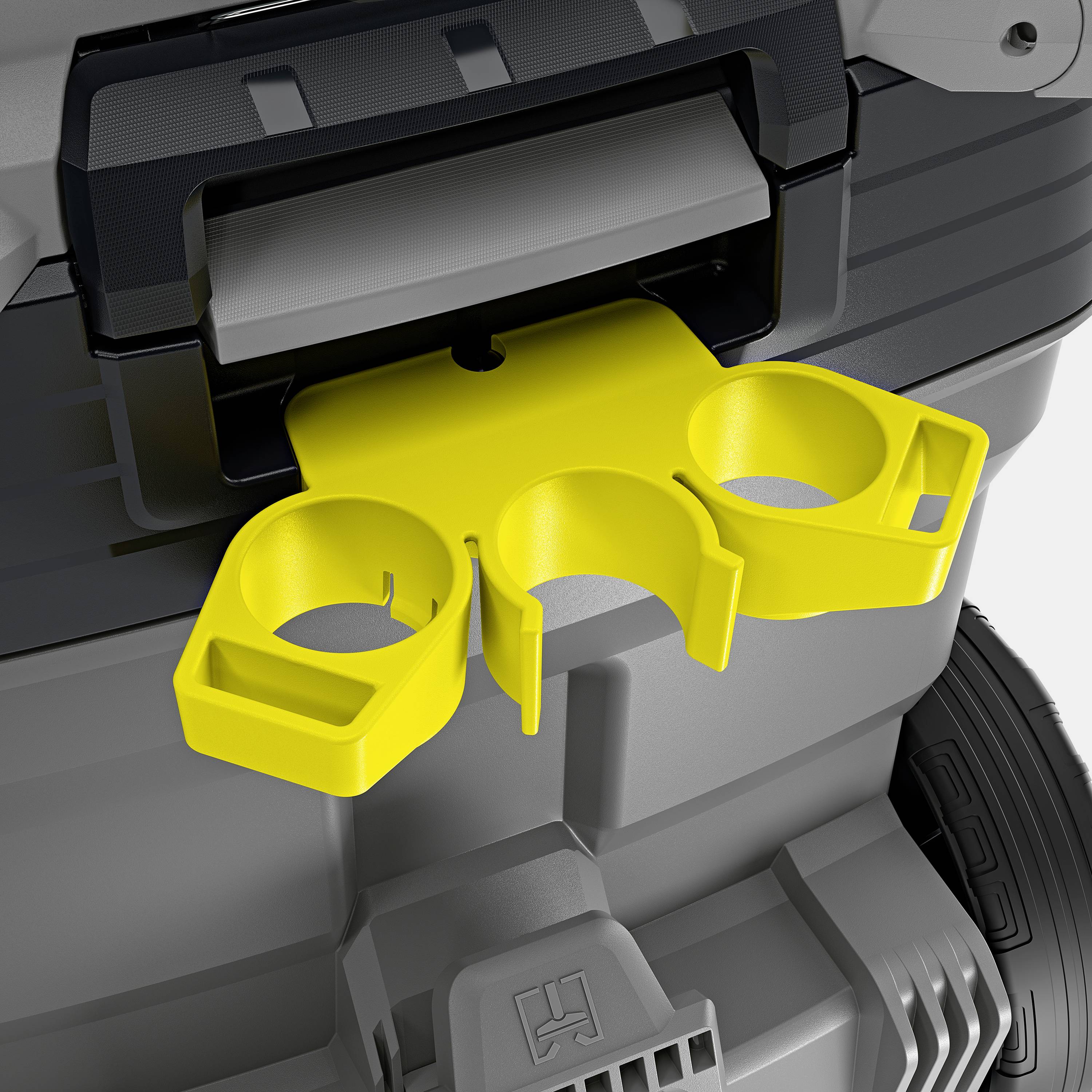 Žlutý držák láhve je připevněn k šedému strukturovanému zařízení.