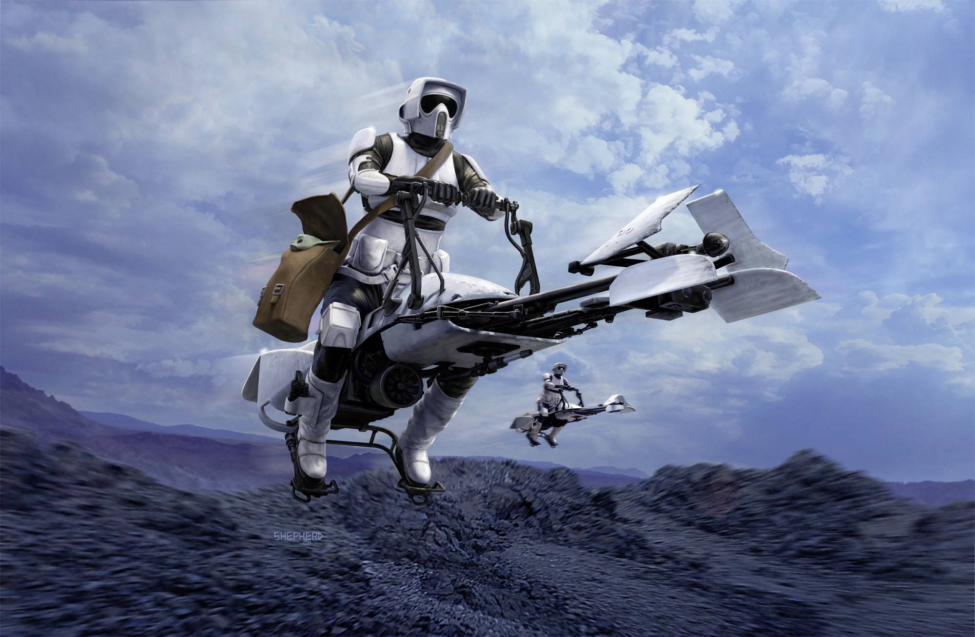 Dva lidé v bílých, futuristických zbrojích jezdí po skalnaté krajině na vznášejících se motorkách. Obloha je zatažená.