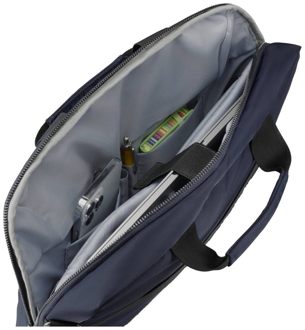 Otevřená tmavě modrá brašna na notebook s mobilním telefonem, perem a poznámkovým blokem uvnitř.