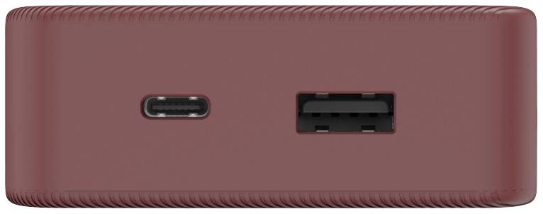 Červené elektronické zařízení s USB-C portem a USB-A portem, které leží vedle sebe na hladkém povrchu.