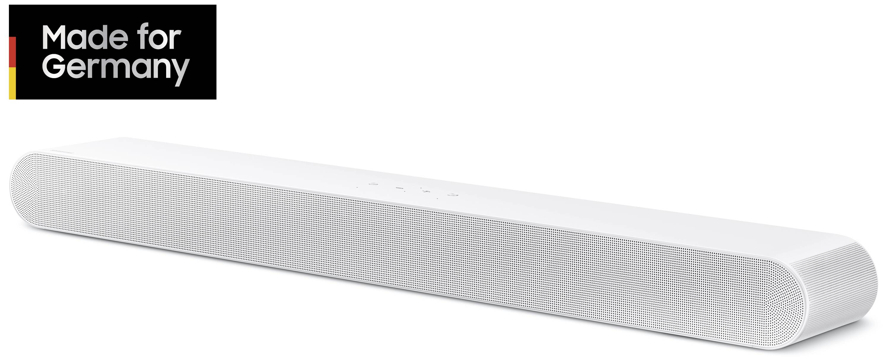 Bílý soundbar s jednoduchým designem, označený štítkem "Vyrobeno pro Německo".