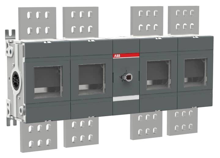 Elektrický odpínač se skládá z několika obdélníkových sekcí a centrálním otočným spínačem upevněným na kovovém podkladu.