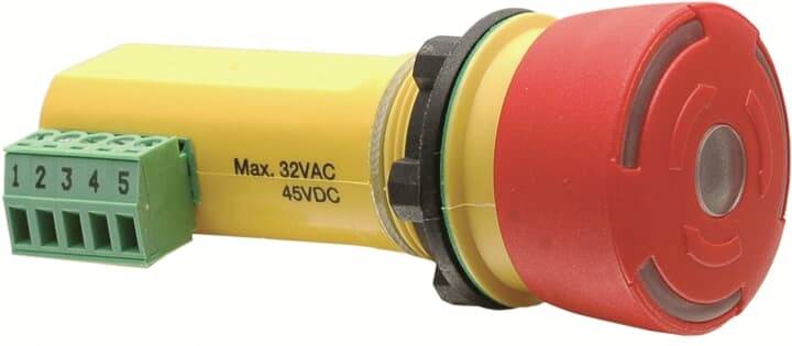 Červený, kulatý nouzový vypínač se žlutým krytem a zelenou připojovací lištou. Označený textem "Max. 32VAC 45VDC".