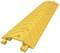 Žlutý plastový kabelový chránič s několika kanály pro kabely. Vhodný pro použití v průmyslovém nebo event prostoru.