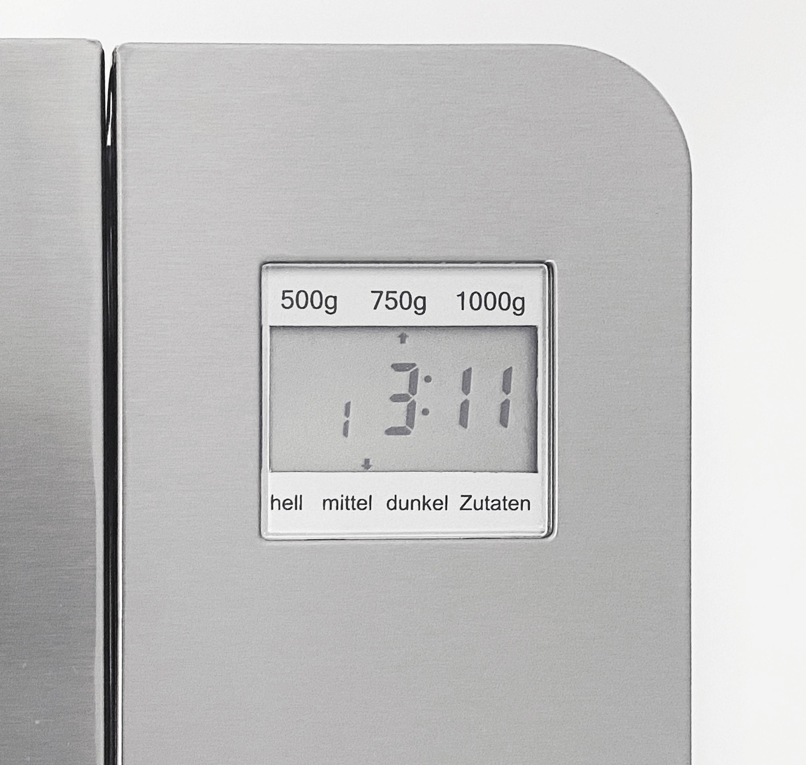 Digitální kuchyňská váha zobrazuje '1:311' na displeji s možnostmi pro 500g, 750g, 1000g a nastavením jasu: světlý, střední, tmavý.