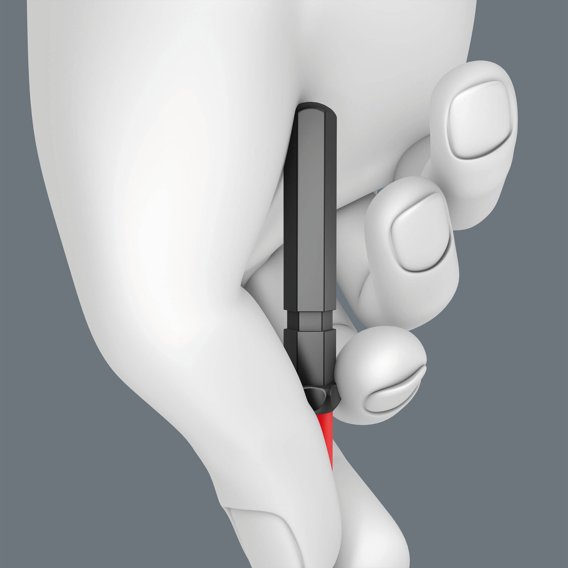 Ruka drží černý USB flash disk blízko šedého pozadí.