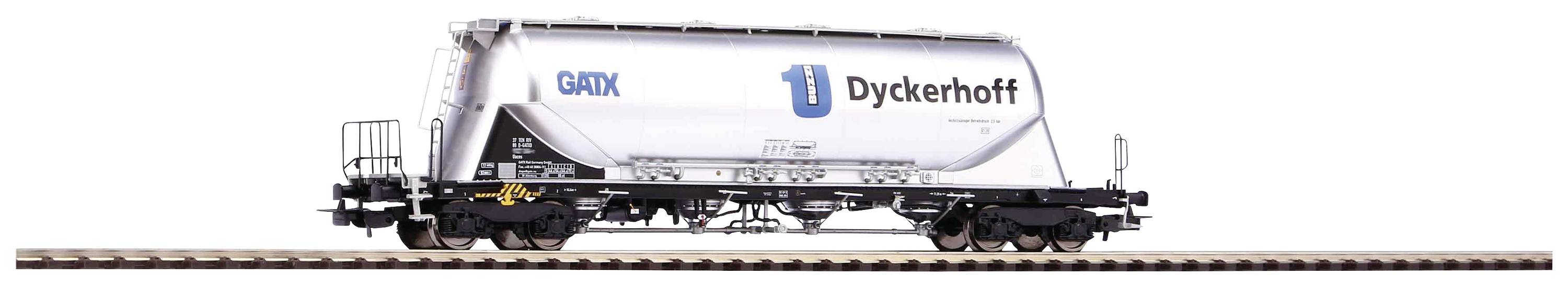 Nákladní vagon společnosti Dyckerhoff určený pro přepravu sypkého materiálu, stojící na koleji.