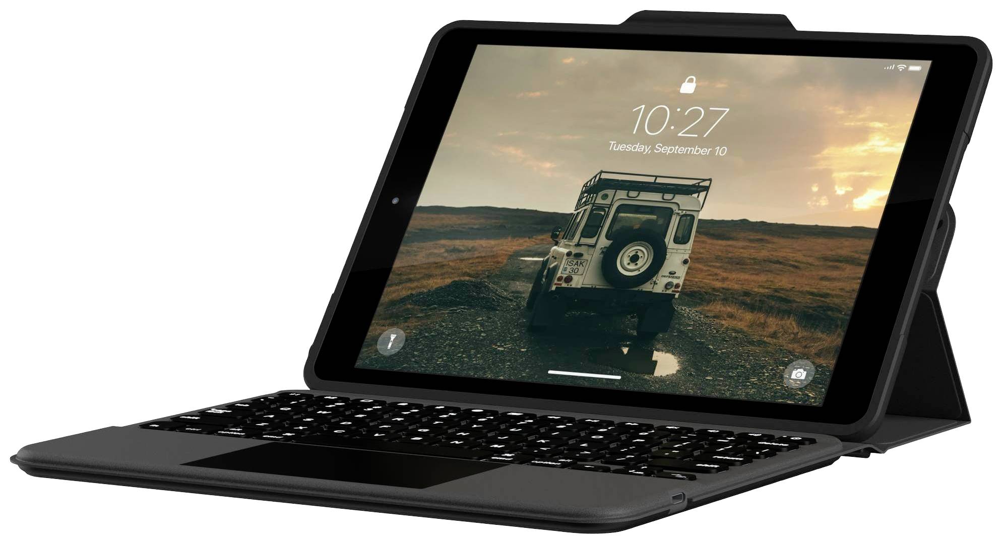 Tablet v černém obalu s integrovanou klávesnicí. Na obrazovce je zobrazeno datum 'Úterý, 10. září' a čas '10:27'.