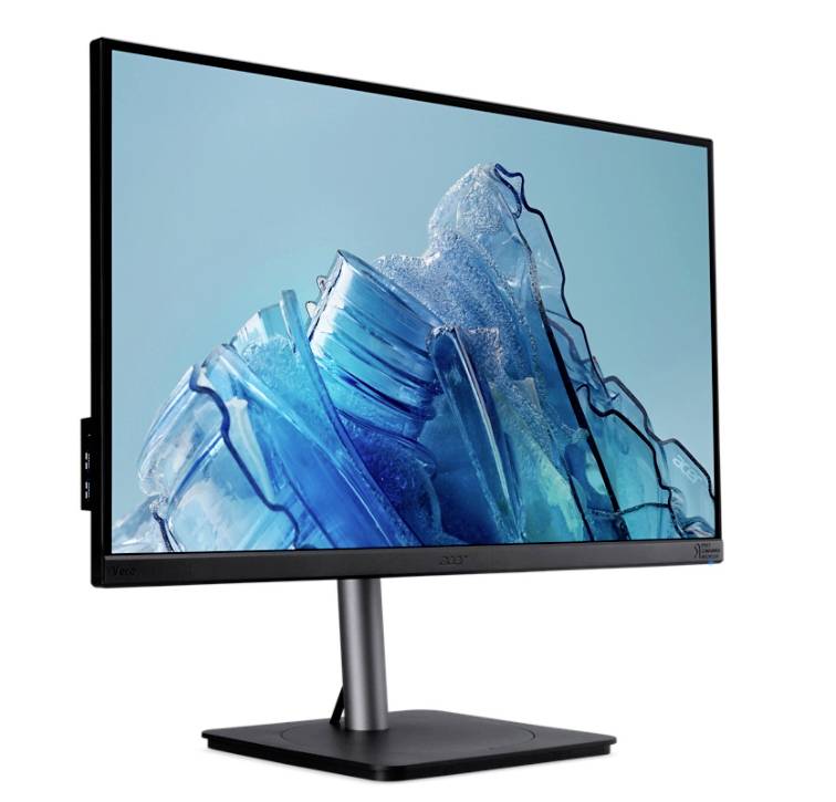 Počítačový monitor zobrazuje vrstvený motiv ledových ker na modrém pozadí. Monitor je umístěn na černém stojanu.
