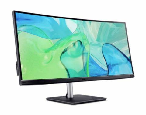 Zakřivený počítačový monitor s abstraktním modro-zeleným pozadím. Monitor má tenký rámeček.