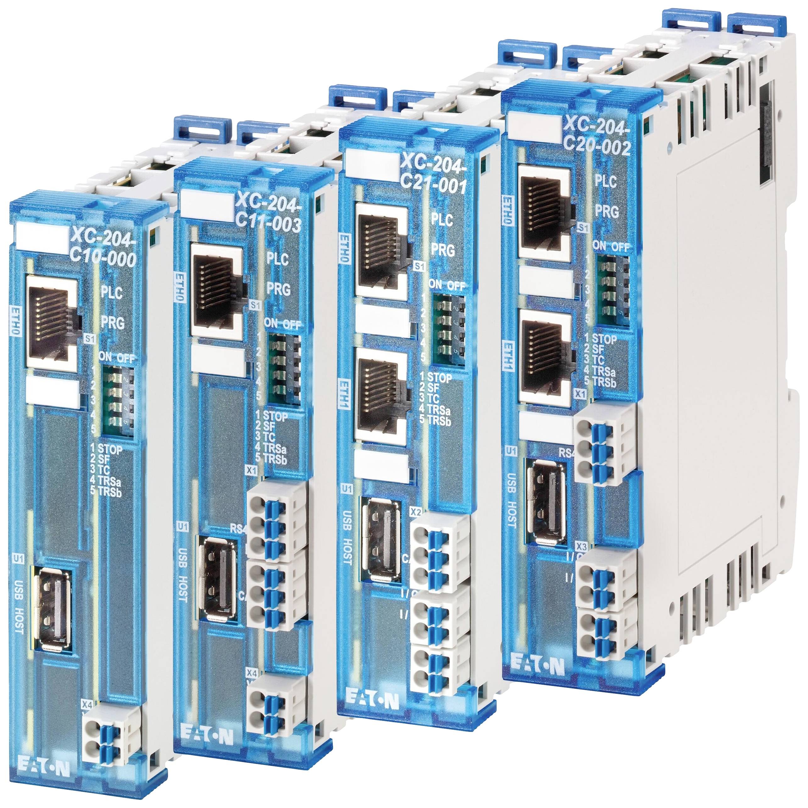 Čtyři modré řídicí jednotky Eaton v řadě, modely XC-204, s připojením a přepínači pro 'PLC' a 'PRG', s různými sériovými čísly.