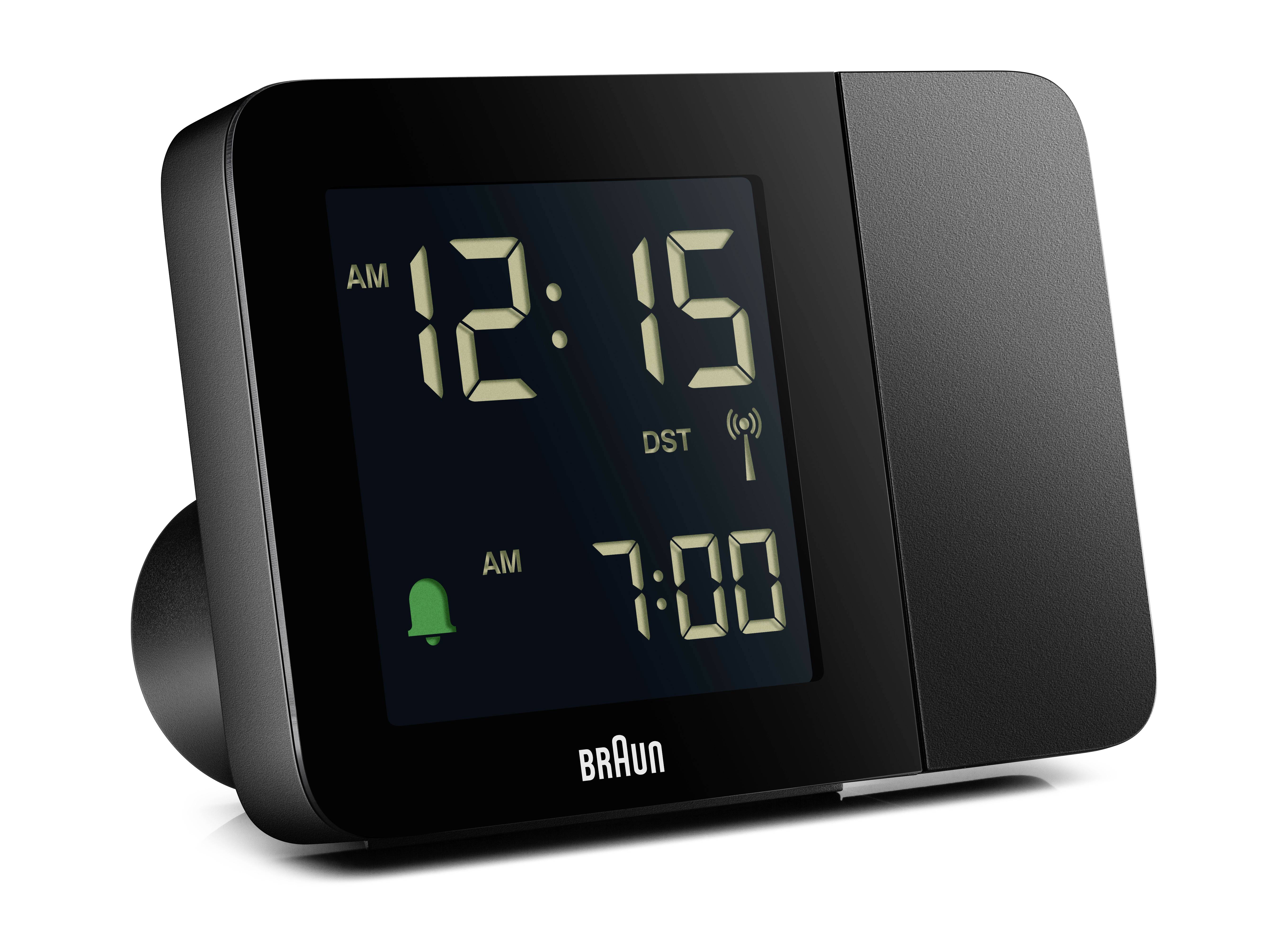 Digitální budík ukazuje 12:15 a nastavenou budící dobu 7:00. Symboly 'AM' a 'DST' jsou viditelné.